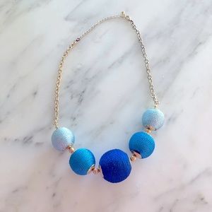 Blue and gold necklace.